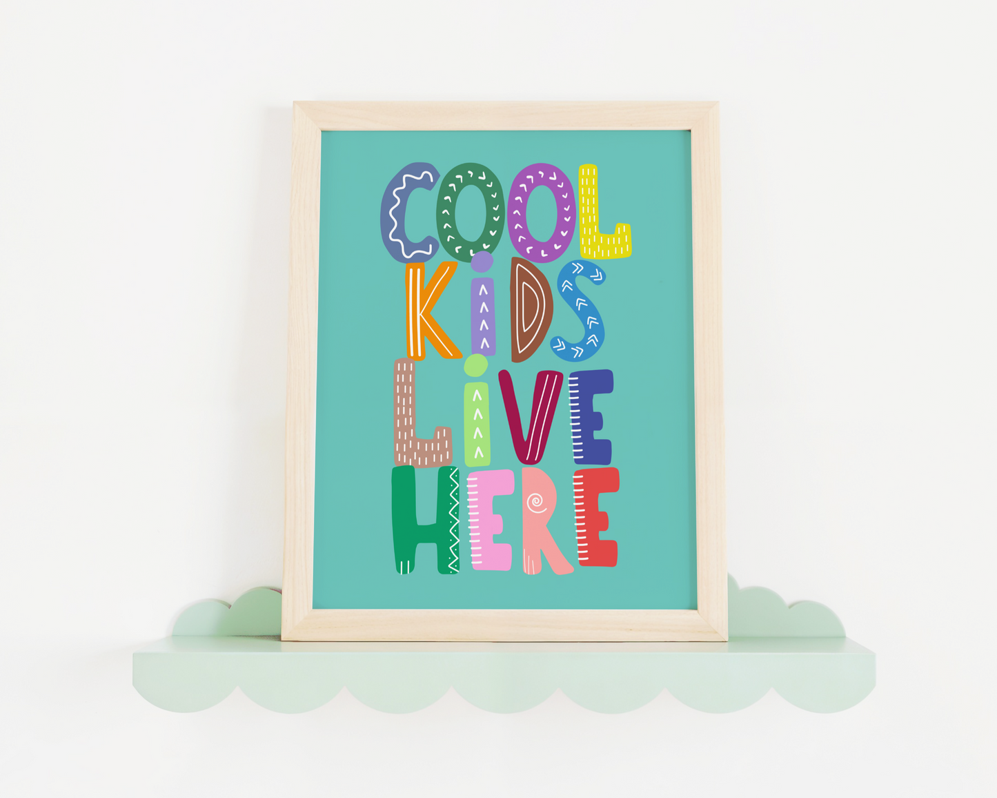 artwork with 'Cool Kids Live Here' text on a teal background
