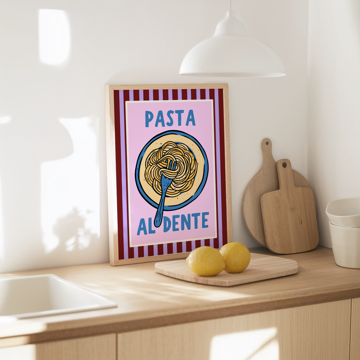 Framed poster with 'Pasta Al Dente' design on a kitchen counter.