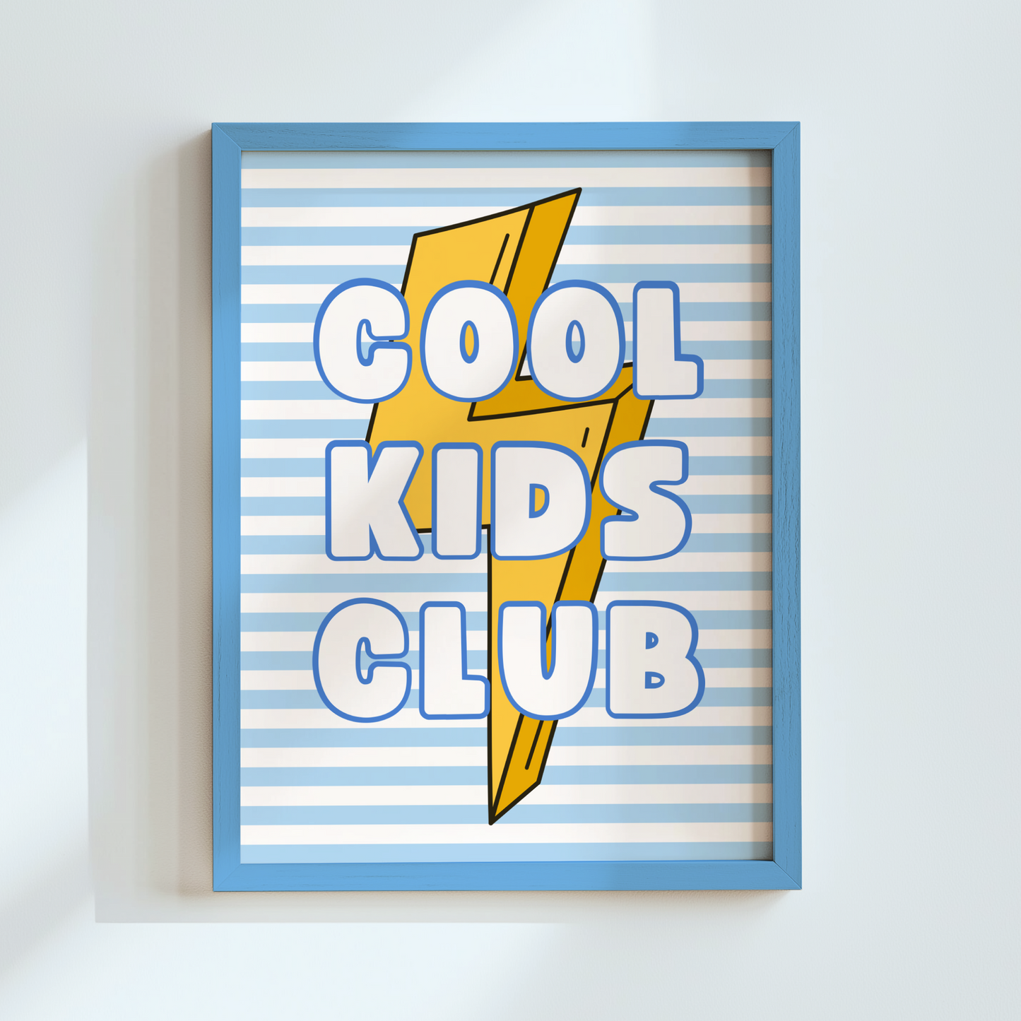 poster with 'Cool Kids Club' text and lightning bolt design on a white wall.