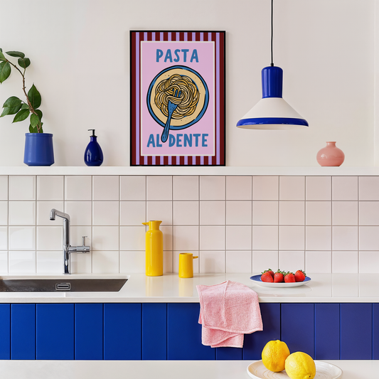 Modern kitchen with colorful decor, including a 'Pasta Al Dente' poster.